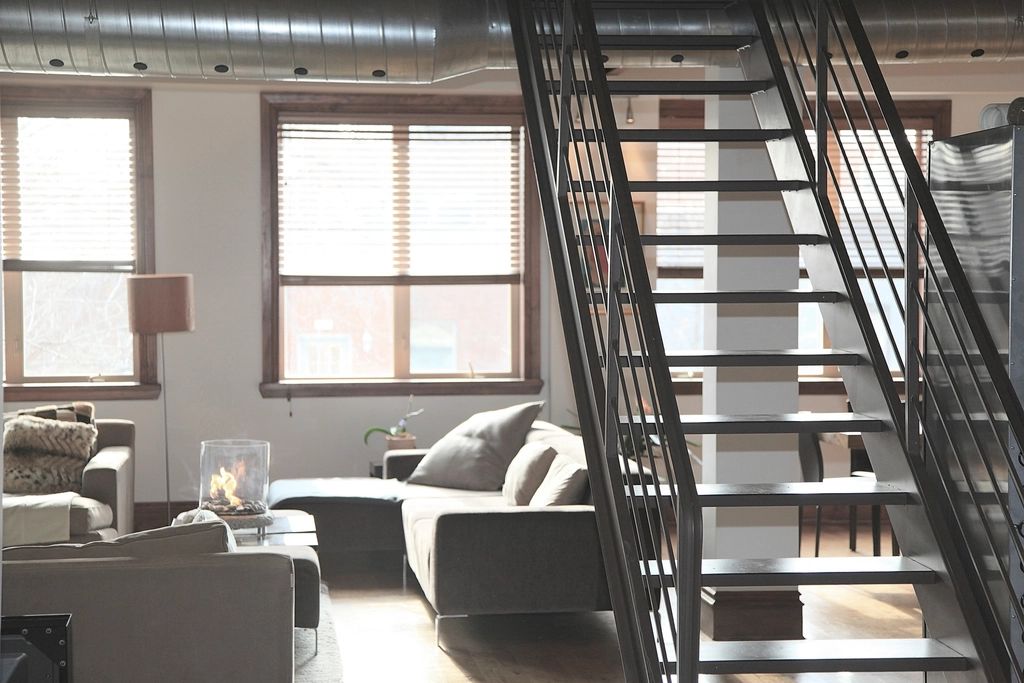 A suite sitting room with a sofa and armchairs